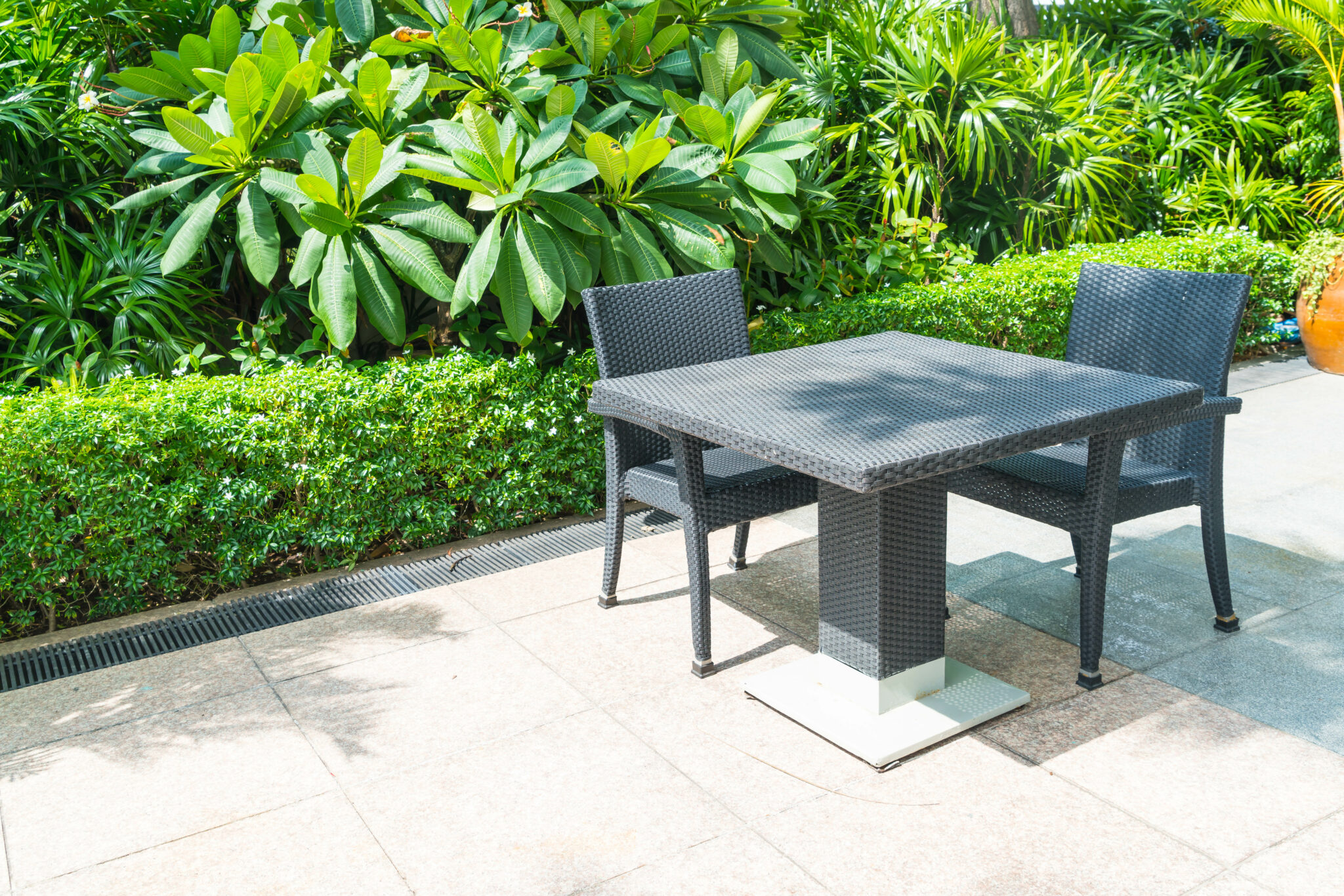 Outdoor patio with empty chair and table